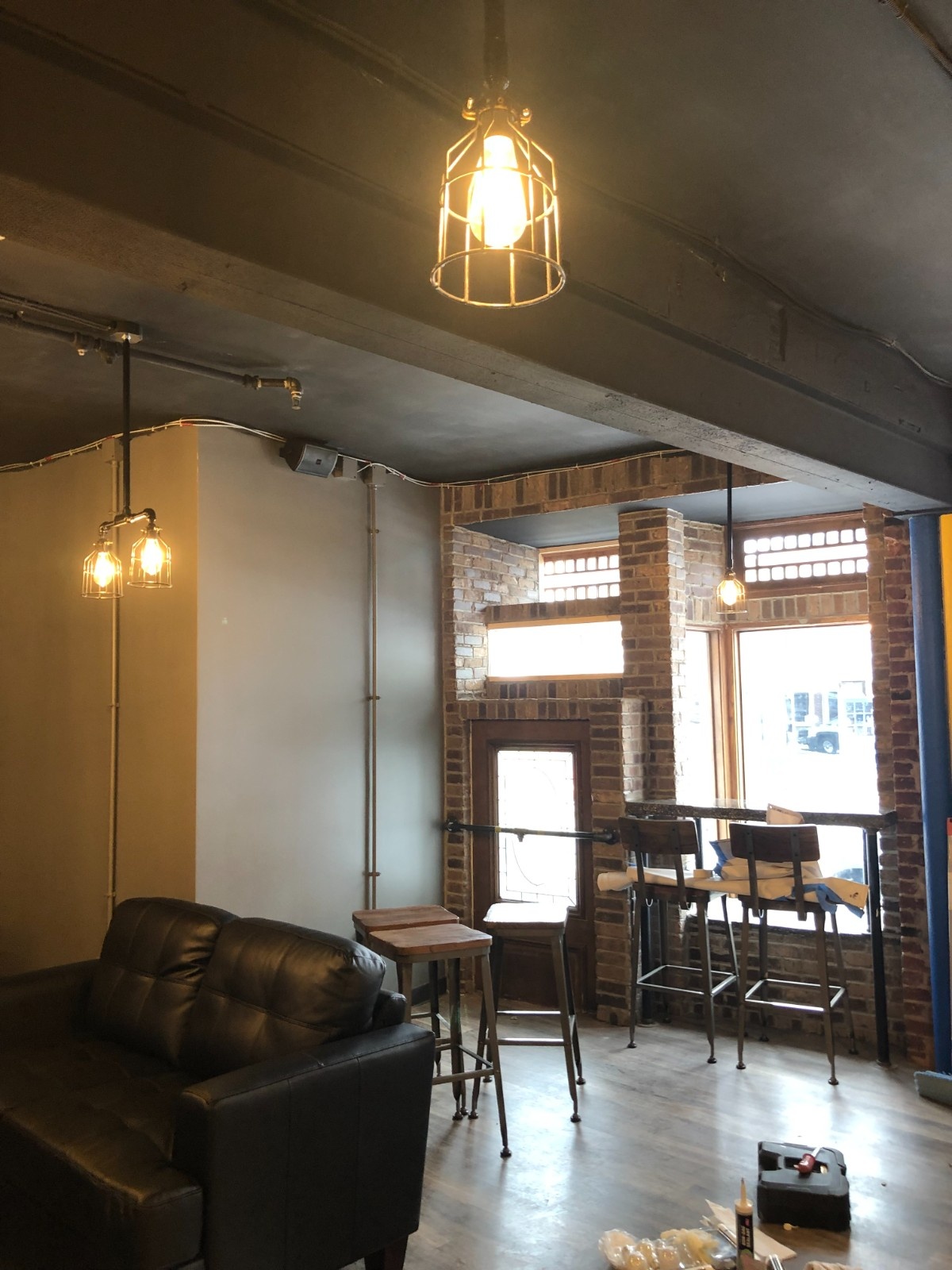 Professional commercial interior painting by Texas Pro Painters featuring matte black ceiling